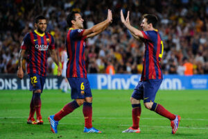 Xavi e Messi atuaram juntos e fizeram história no Barcelona (Crédito: GettyImages)