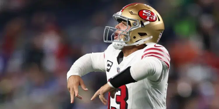 Brock Purdy, quarterback do San Francisco 49ers, comemora após passar para um touchdown no último quarto da partida contra o Seattle Seahawks
