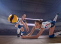 Atleta de vôlei realizando defesa - Créditos: depositphotos.com / arturdidyk@gmail.com