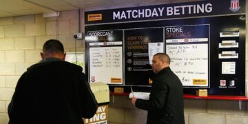 Apostas em esportes: Torcedores fazendo apostas na Premier League