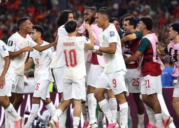 Jogadores de Marrocos comemorando gol de empate